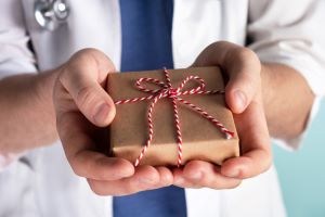 locum provider giving present, giving back by taking holiday healthcare jobs