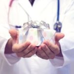 gifts for healthcare workers: a healthcare provider holding a gift