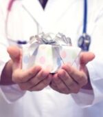 gifts for healthcare workers: a healthcare provider holding a gift