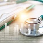 a stethoscope with statistic images measuringh the physician job market snapshot for 2022