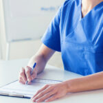A nurse practitioner looking over patient records