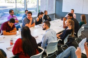 A staff meeting in Barton Associates' Tempe, AZ office