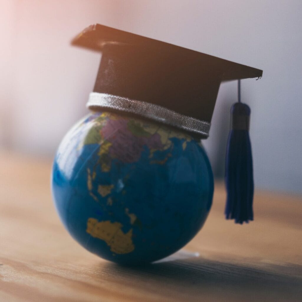 A globe with a graduation cap