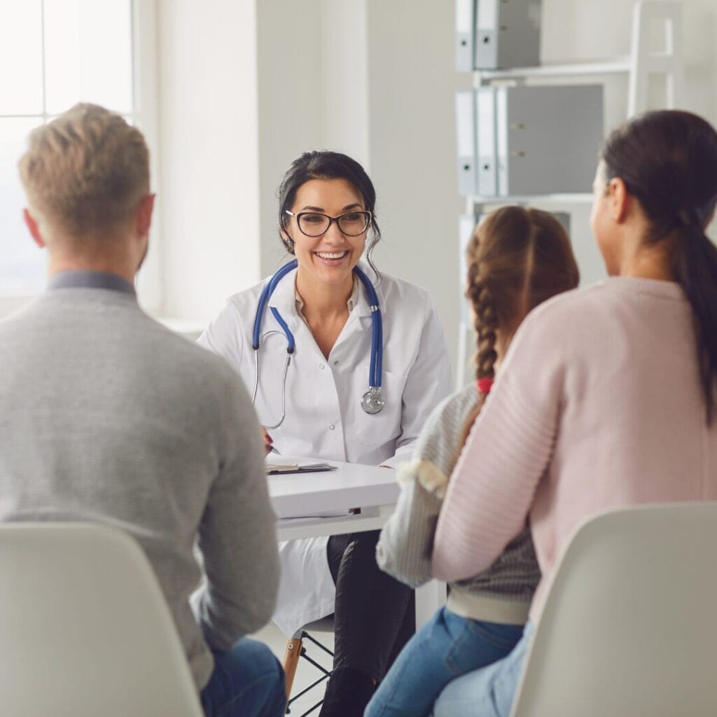 A family medicine provider speaking to a family