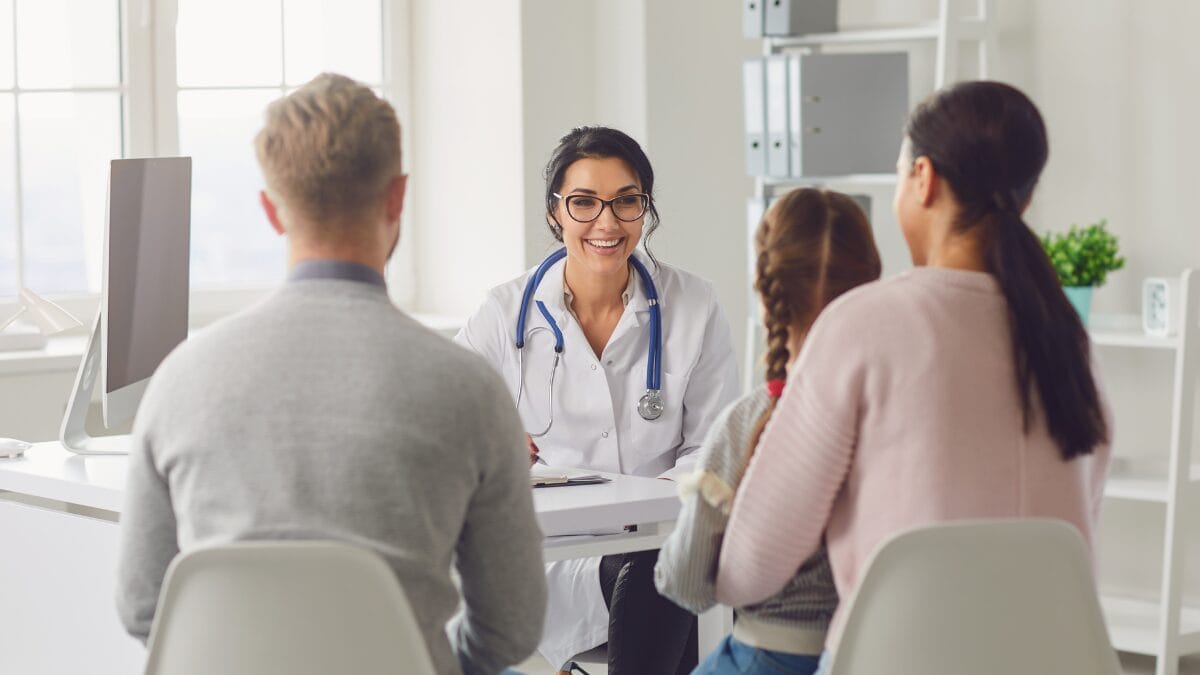 A family medicine provider talking to a family