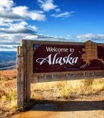 A sign welcoming people to Alaska