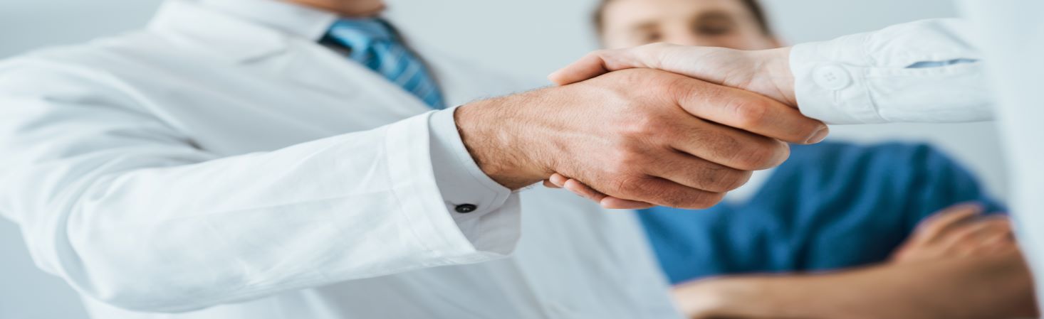client finds locum tenens staffing solution, shaking hand with doctor